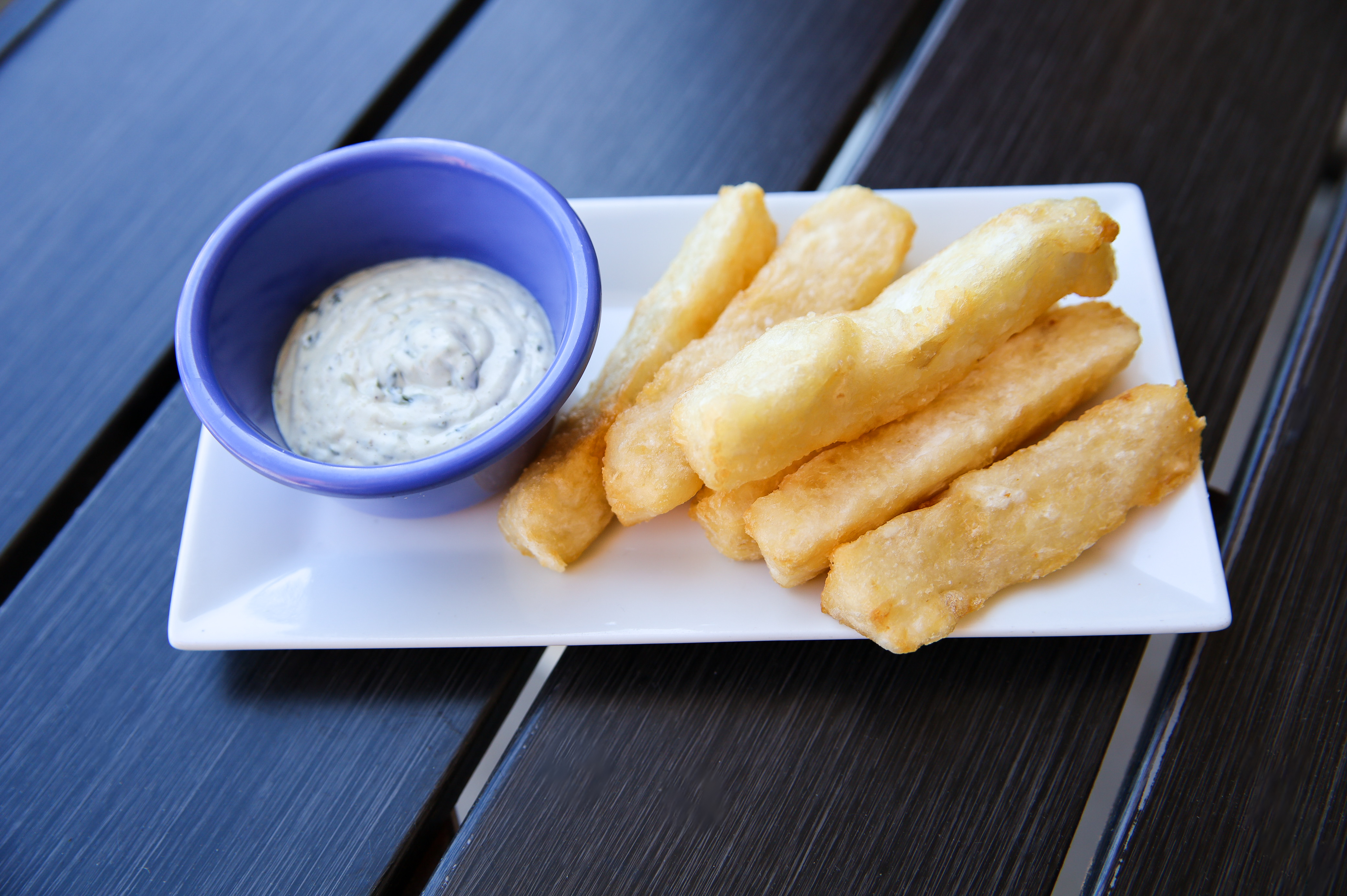 Yucca Fries w/ our crema de cilantro sauce